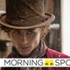 Timothée Chalamet in a top hat and scarf, in costume for his upcoming Warner Bros. Wonka prequel movie.